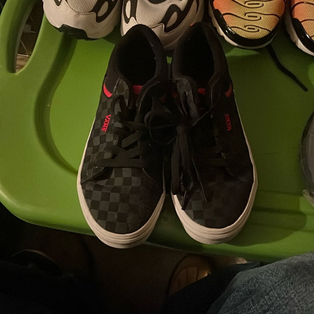 Red and black Vans sneakers.